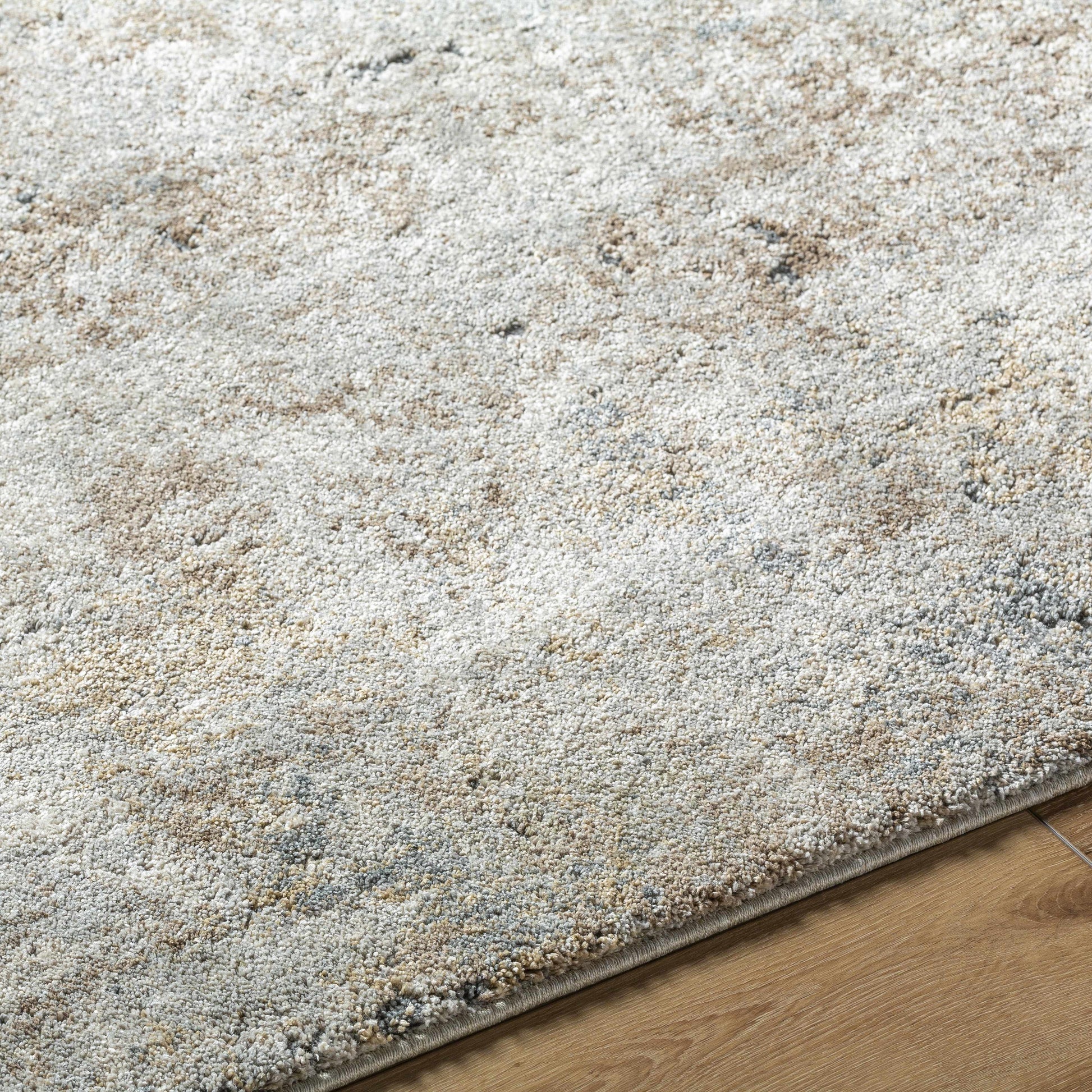 Textured area rug on a wooden floor