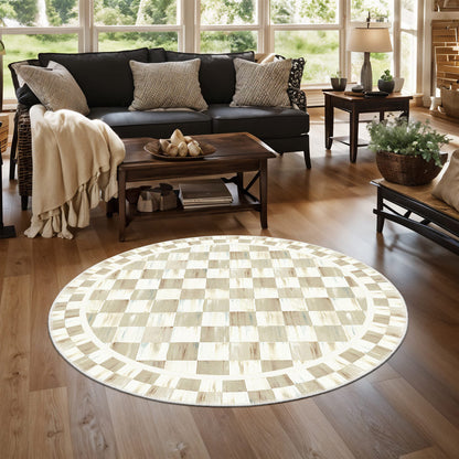 Living room with a round checkered rug, dark sofa, and wooden coffee table.