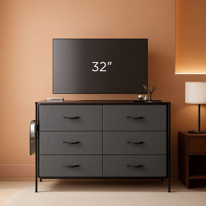 Gray dresser with a television displaying '32”' in a room with a lamp and wooden sideboard.